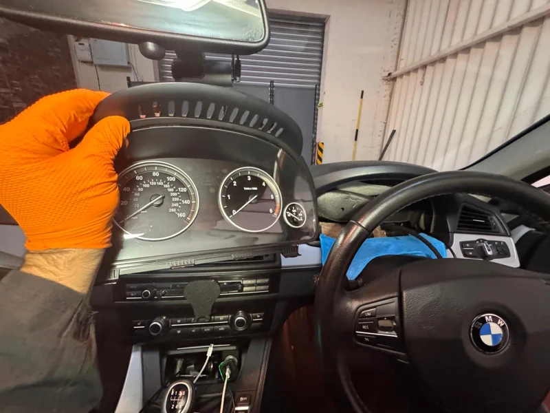 Original analogue instrument cluster removed from the BMW