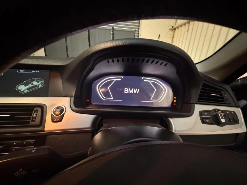 Digital instrument cluster showing the BMW startup display