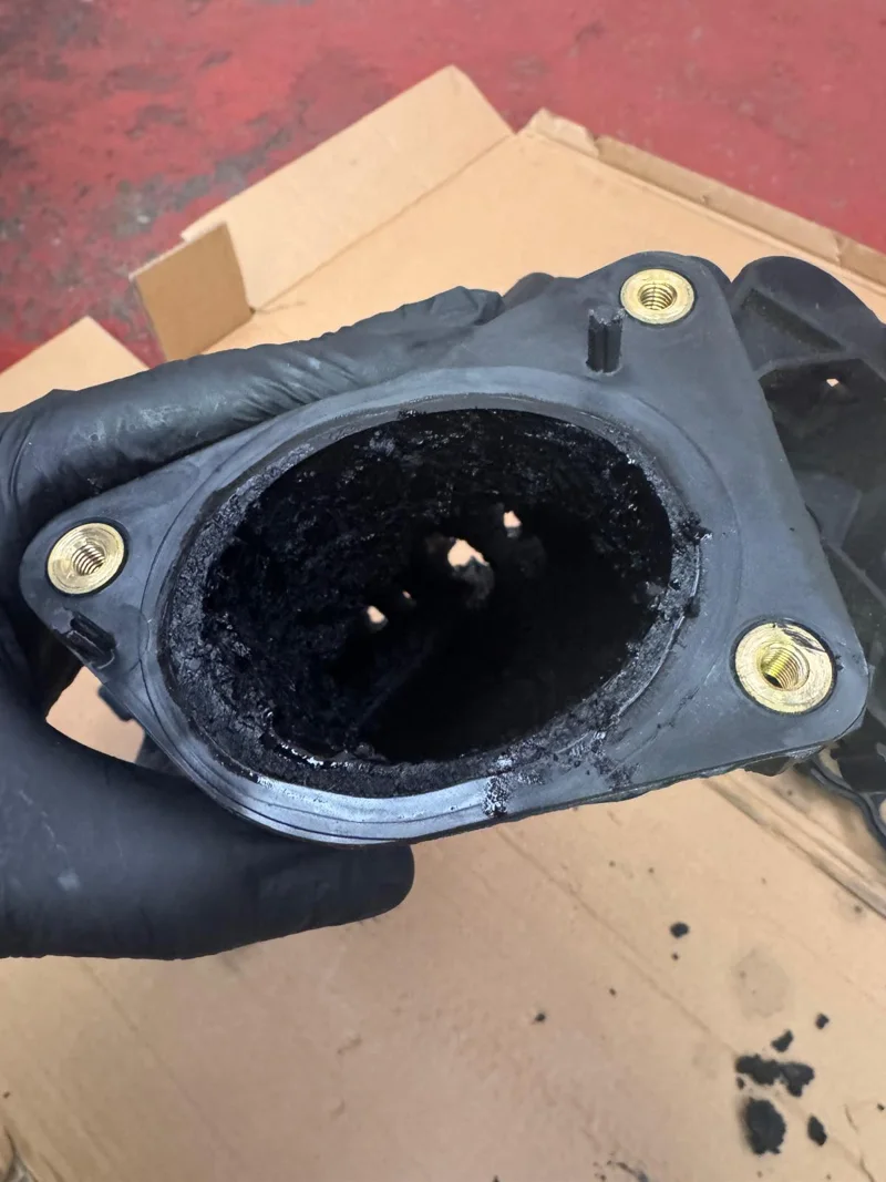 Carbon deposits inside the removed intake manifold