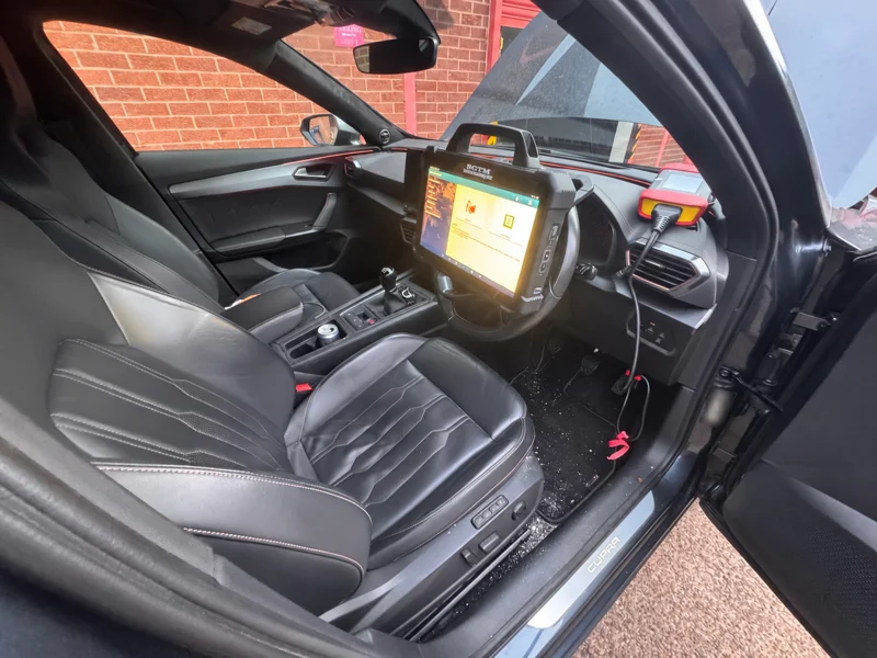 Cupra interior with diagnostic equipment and identification label blurred