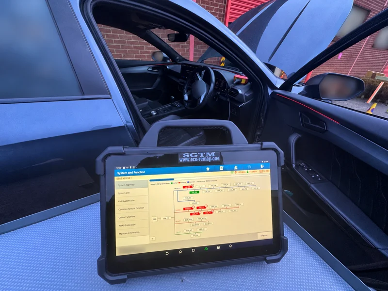 Diagnostic tablet connected to the Cupra; identifying details blurred