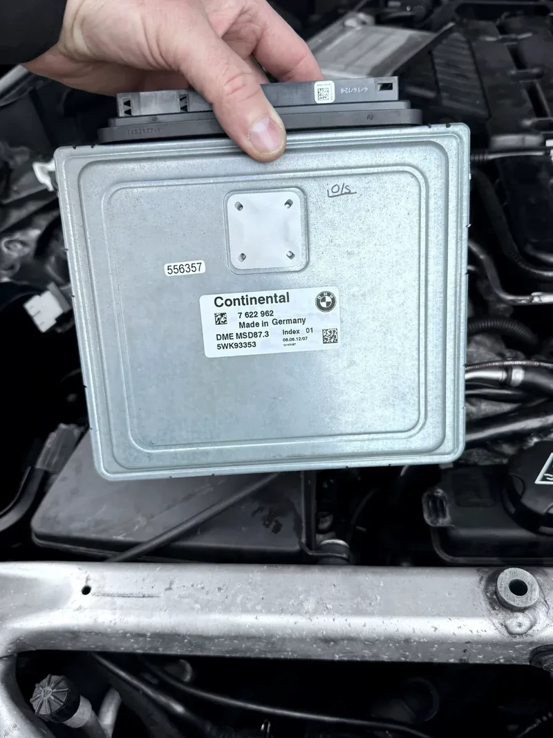 Rolls-Royce Continental ECU in hand during programming work